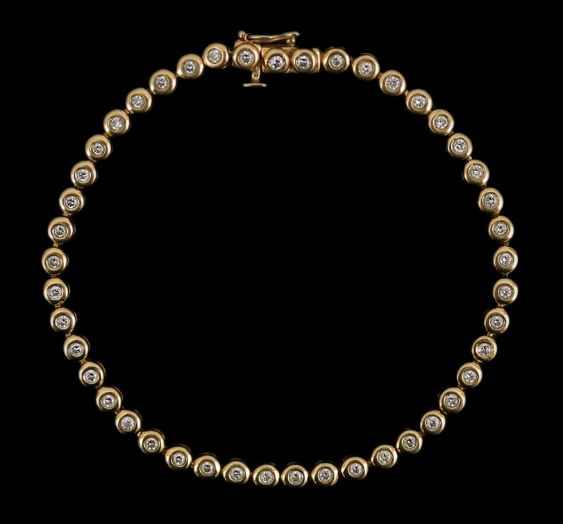 A modern gold and forty five stone round cut diamond set tennis bracelet